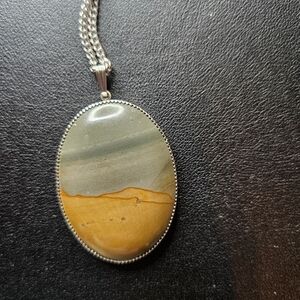 Elegant Silver and Tan Pendant Necklace